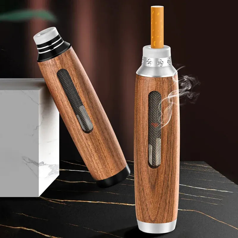 Wooden smoking device with silver accents on a dark surface