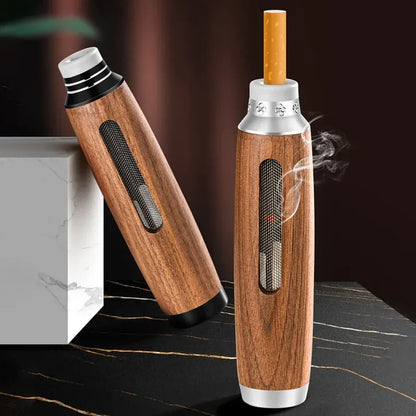 Wooden smoking device with silver accents on a dark surface